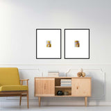 Modern living room with a yellow armchair, wooden console, and two framed pictures on the wall