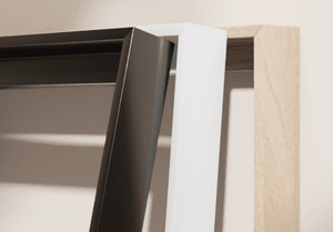 Close-up of a modern furniture piece with a black frame and wooden accents.